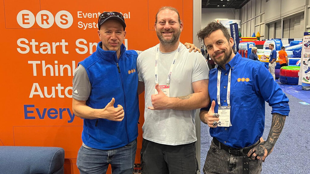 ERS with a customer at the IAAPA booth